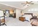 Spacious main bedroom featuring vaulted ceilings, a ceiling fan, natural light, and a warm, inviting ambiance at 323 45Th Ave. N, North Myrtle Beach, SC 29582