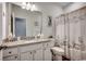 Charming bathroom with granite countertops, a seashell shower curtain, and white cabinetry at 325 High Falls Dr., Conway, SC 29526