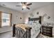 Bedroom featuring an ornate wood bedframe, decorative coastal accents, and a ceiling fan at 325 High Falls Dr., Conway, SC 29526