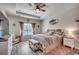 Comfortable bedroom with tray ceilings, a large window, and coastal-themed decor at 325 High Falls Dr., Conway, SC 29526