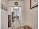 Inviting hallway featuring wood-look flooring leading to a bright and airy living space at 325 High Falls Dr., Conway, SC 29526