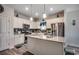 Bright kitchen featuring granite countertops, stainless steel appliances, white cabinetry, and a center island at 325 High Falls Dr., Conway, SC 29526