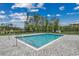 A community swimming pool surrounded by a paved deck and black metal fence at 325 High Falls Dr., Conway, SC 29526