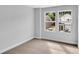 Bedroom with large windows, view of the neighboring houses, and neutral carpeting at 327 Sandridgebury Dr. # 72, Little River, SC 29566