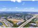 A wide aerial shot captures a vast residential area near a highway and distant cityscape at 331 Sandridgebury Dr. # 74, Little River, SC 29566