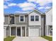 Charming townhouse featuring a gray siding and a white garage door with great curb appeal at 331 Sandridgebury Dr. # 74, Little River, SC 29566