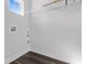 Utility room with gray-toned floors, shelving, and window at 335 Sandridgebury Dr. # 75, Little River, SC 29566