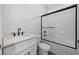 Bathroom featuring single vanity with white cabinetry, and a shower with modern door and hardware at 3372 Gurley Rd., Loris, SC 29569