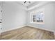 Bright bedroom featuring a large window, modern flooring, and neutral walls for a comfortable living space at 3372 Gurley Rd., Loris, SC 29569