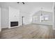 Bright, open living room with hardwood floors, a cozy fireplace, and ample natural light at 3372 Gurley Rd., Loris, SC 29569