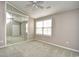 Bedroom with neutral walls, carpeted flooring, ceiling fan, and mirrored closet doors at 3506 Evergreen Way # 3506, Myrtle Beach, SC 29577