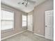 Bedroom with neutral walls, carpeted flooring, ceiling fan, and two windows with white blinds at 3506 Evergreen Way # 3506, Myrtle Beach, SC 29577