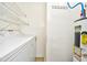 Laundry room with a washer, dryer, wire shelving, and a water heater at 3506 Evergreen Way # 3506, Myrtle Beach, SC 29577