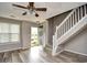 Bright living room featuring modern flooring, neutral paint, and staircase, creating a welcoming atmosphere at 3506 Evergreen Way # 3506, Myrtle Beach, SC 29577