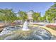 Scenic town center featuring a beautiful fountain, blooming flowers, and a charming building at 3506 Evergreen Way # 3506, Myrtle Beach, SC 29577