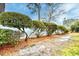 View of the landscaped yard with trimmed hedges and a white fence at 3506 Evergreen Way # 3506, Myrtle Beach, SC 29577