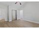 Light-filled bedroom featuring hardwood floors, closet, and ceiling fan at 4161 Hibiscus Dr. # 15-302, Little River, SC 29566