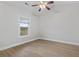 Bright bedroom with hardwood flooring, large window, and ceiling fan at 4161 Hibiscus Dr. # 15-302, Little River, SC 29566