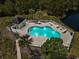 Aerial view of the community pool featuring several lounge chairs at 4161 Hibiscus Dr. # 15-302, Little River, SC 29566