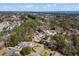 Aerial view showcasing a residential neighborhood near a wooded area and the ocean at 4350 Goude St., Murrells Inlet, SC 29576