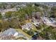 Aerial view of a residence highlighting landscaping, a long driveway, and fenced-in yard at 4350 Goude St., Murrells Inlet, SC 29576