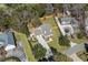 Overhead view of beautiful home showcasing well-manicured lawns, mature landscaping, and neighboring houses at 4350 Goude St., Murrells Inlet, SC 29576