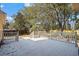 Back deck with white railings surrounded by mature trees at 4350 Goude St., Murrells Inlet, SC 29576