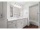 Bright bathroom featuring a double sink vanity with modern fixtures and a shower-tub combo at 4350 Goude St., Murrells Inlet, SC 29576