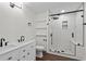 Modern bathroom featuring double vanity, subway tile shower, and black hardware at 4350 Goude St., Murrells Inlet, SC 29576