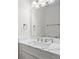 Close up of bathroom sink with sleek modern fixtures and white marble-look countertop at 4350 Goude St., Murrells Inlet, SC 29576