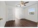 Bedroom with hardwood floors, ceiling fan, two closets, and natural light at 4350 Goude St., Murrells Inlet, SC 29576