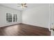 An empty bedroom with hardwood floors and a large window at 4350 Goude St., Murrells Inlet, SC 29576