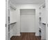 A spacious walk-in closet features built-in shelving and ample storage space at 4350 Goude St., Murrells Inlet, SC 29576