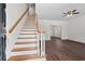 Bright entryway features hardwood floors, a staircase, and an open floor plan at 4350 Goude St., Murrells Inlet, SC 29576