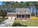 Beautiful two-story brick home with a well-manicured lawn and inviting front porch at 4350 Goude St., Murrells Inlet, SC 29576