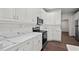 Bright kitchen with stainless steel appliances, white cabinets, and marble-look countertops at 4350 Goude St., Murrells Inlet, SC 29576
