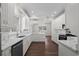 Bright kitchen with stainless steel appliances, white cabinets, and marble-look countertops at 4350 Goude St., Murrells Inlet, SC 29576