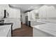 Bright kitchen with stainless steel appliances, white cabinets, and marble-look countertops at 4350 Goude St., Murrells Inlet, SC 29576