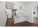 Modern kitchen with white cabinets, quartz counters, and open access to the dining area at 4350 Goude St., Murrells Inlet, SC 29576