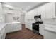 Spacious kitchen with white cabinetry, stainless steel appliances, and a center island at 4350 Goude St., Murrells Inlet, SC 29576