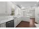 Bright kitchen with stainless steel appliances, white cabinets, and marble-look countertops at 4350 Goude St., Murrells Inlet, SC 29576