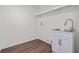 Laundry room featuring a deep sink, storage cabinet, and in-wall water hookups at 4350 Goude St., Murrells Inlet, SC 29576