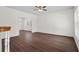 Light filled living room with hardwood floors and view into dining room and kitchen at 4350 Goude St., Murrells Inlet, SC 29576
