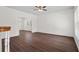 Neutral living room with modern flooring, ample natural light, and an open view to the dining area at 4350 Goude St., Murrells Inlet, SC 29576