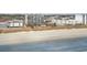 Panoramic aerial view of the condo complex, featuring a sandy beach, ocean, and nearby buildings at 4505 South Ocean Blvd. # 8-D, North Myrtle Beach, SC 29582