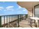 Relax on the balcony with ocean views and a table with chairs at 4505 South Ocean Blvd. # 8-D, North Myrtle Beach, SC 29582