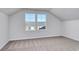 Finished attic with neutral carpeting and two large windows at 491 Wagner Cir., Conway, SC 29526