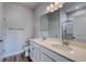 Well-lit bathroom with double vanity, white cabinets, and a glass-enclosed shower at 491 Wagner Cir., Conway, SC 29526