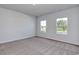 Bright, carpeted bedroom with two large windows offering plenty of natural light at 491 Wagner Cir., Conway, SC 29526