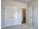 Bedroom featuring double closet doors and an ensuite bathroom at 491 Wagner Cir., Conway, SC 29526